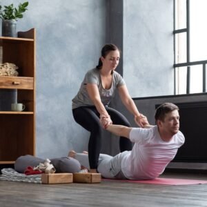 Certified YTT 200 therapeutic yoga training session with guided assisted posture practice